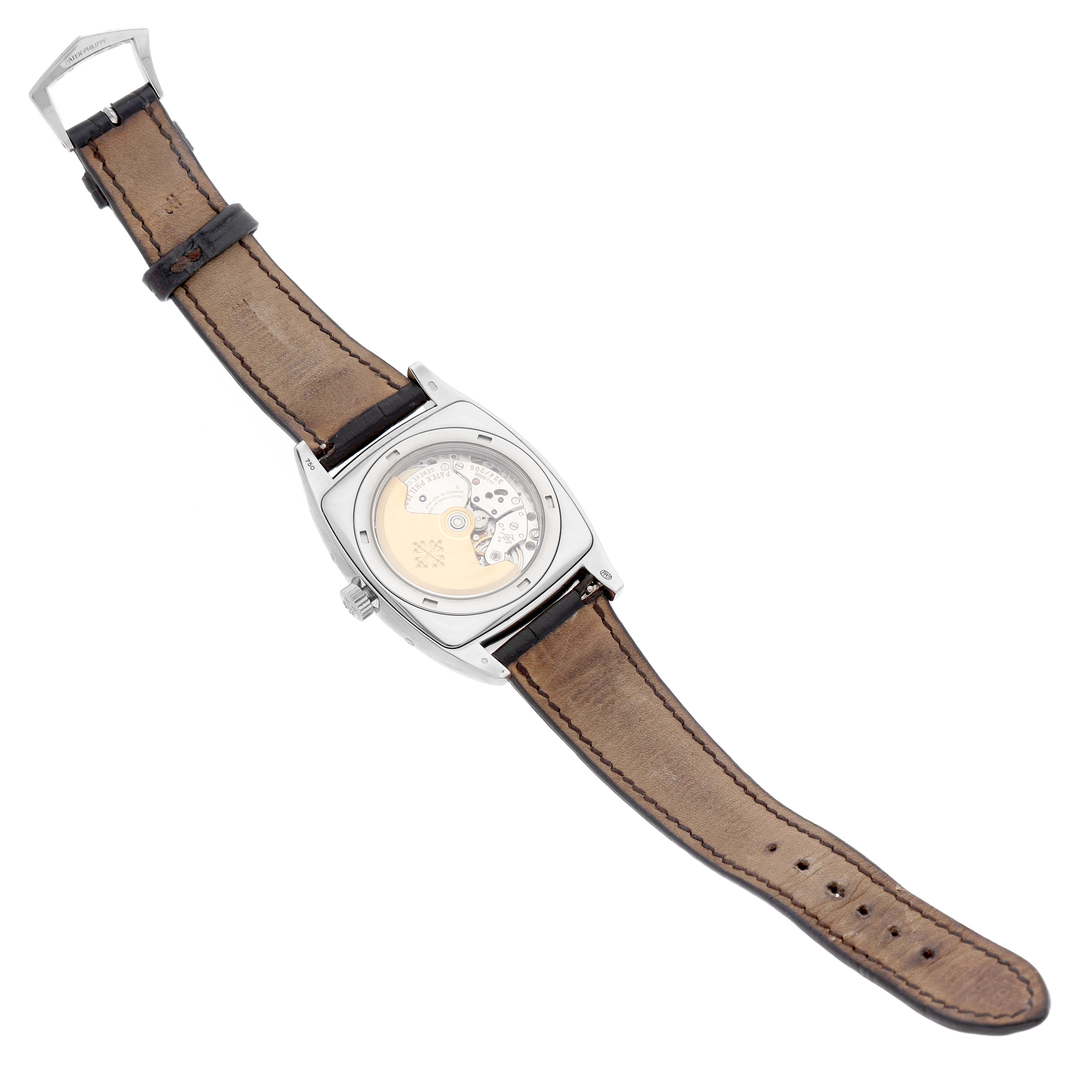 The Patek Philippe Gondolo Men's White Gold Silver Dial watch is shown from the back, highlighting its movement and leather strap.