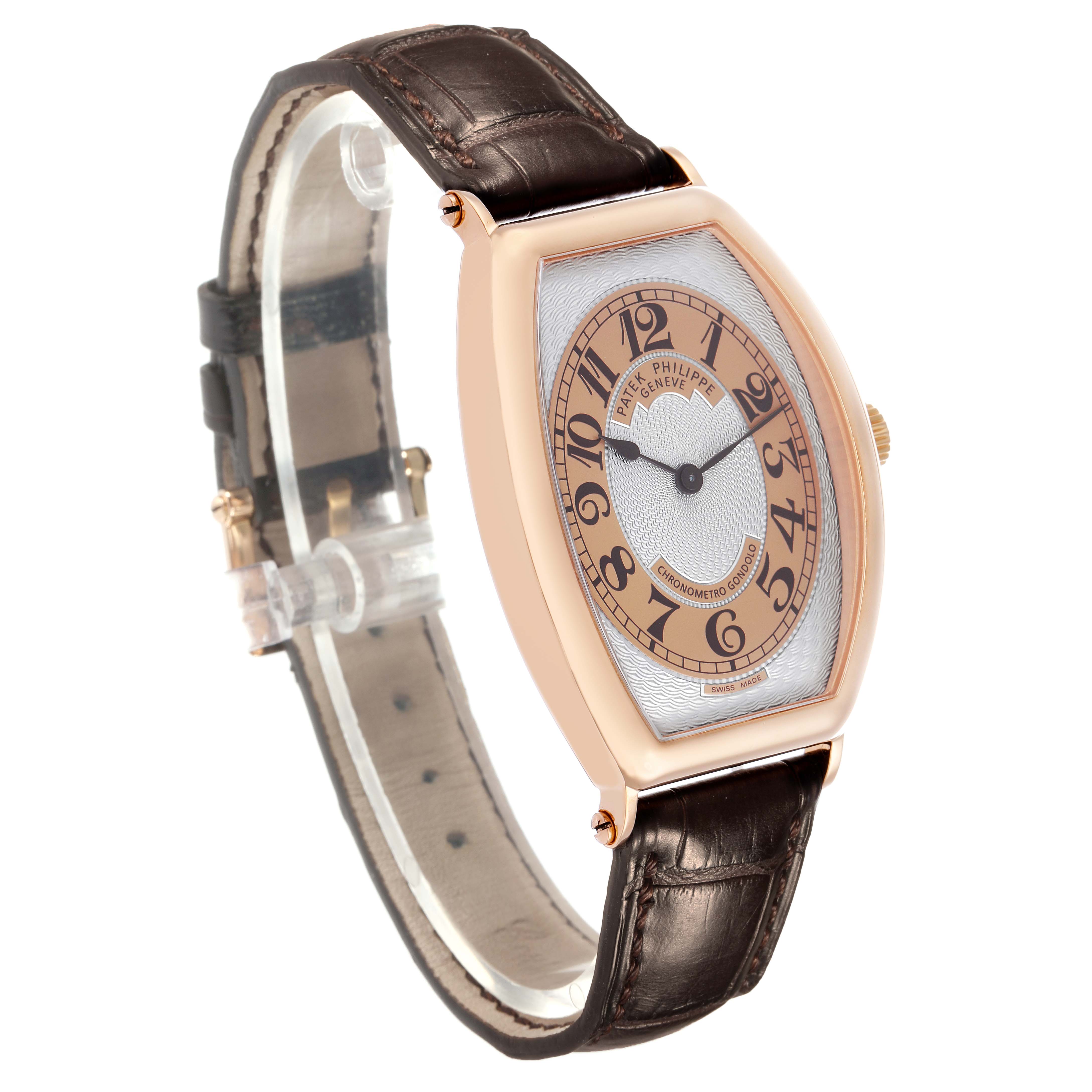 The Patek Philippe Gondolo 5098R Men's Rose Gold Silver Dial watch is shown in a three-quarter angle, highlighting the dial, case, and brown leather strap.