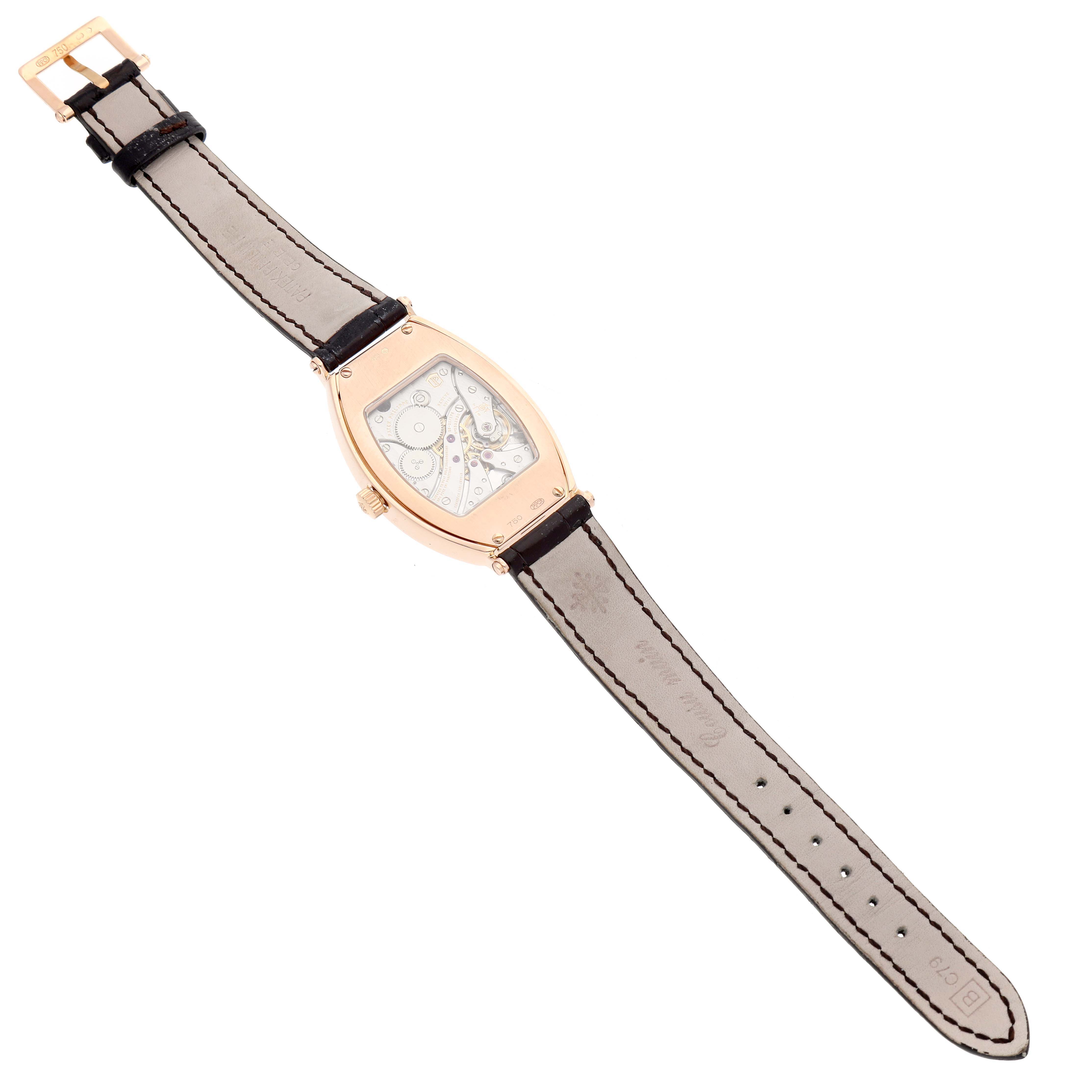 The image shows the back view of a Patek Philippe Gondolo 5098R Men's Rose Gold Silver Dial watch, highlighting its movement and leather strap.