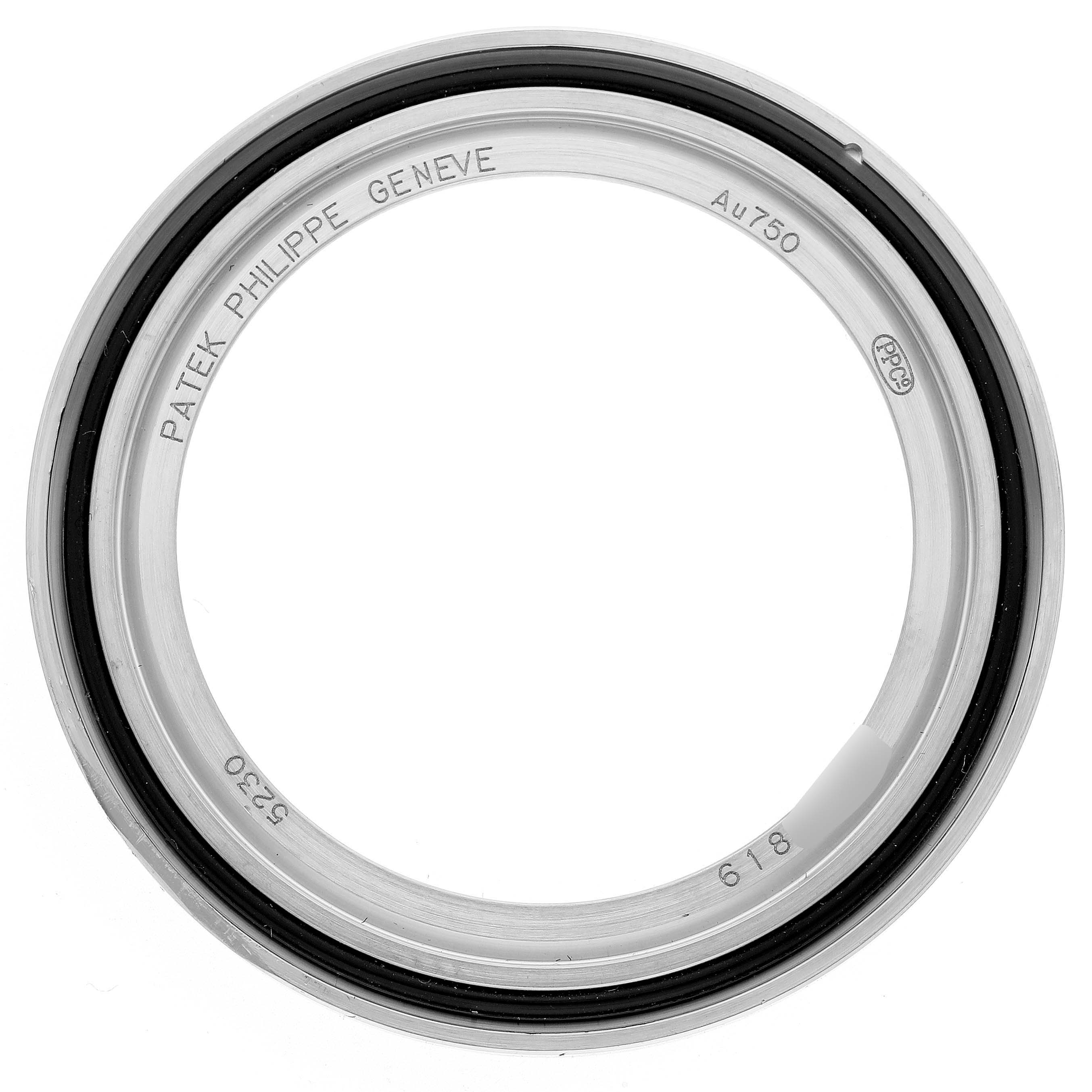 The image shows a top view of a bezel for a Patek Philippe Complications 5230G-001 Men's White Gold Grey Dial watch.