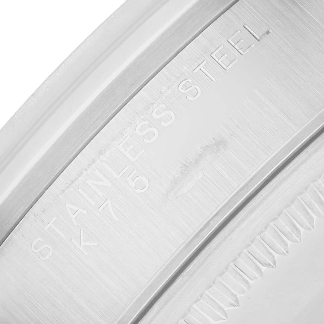 The image shows a close-up of the case back of a Rolex Air-King 14000 Men's Stainless Steel Silver Dial watch, highlighting the "Stainless Steel" engraving.