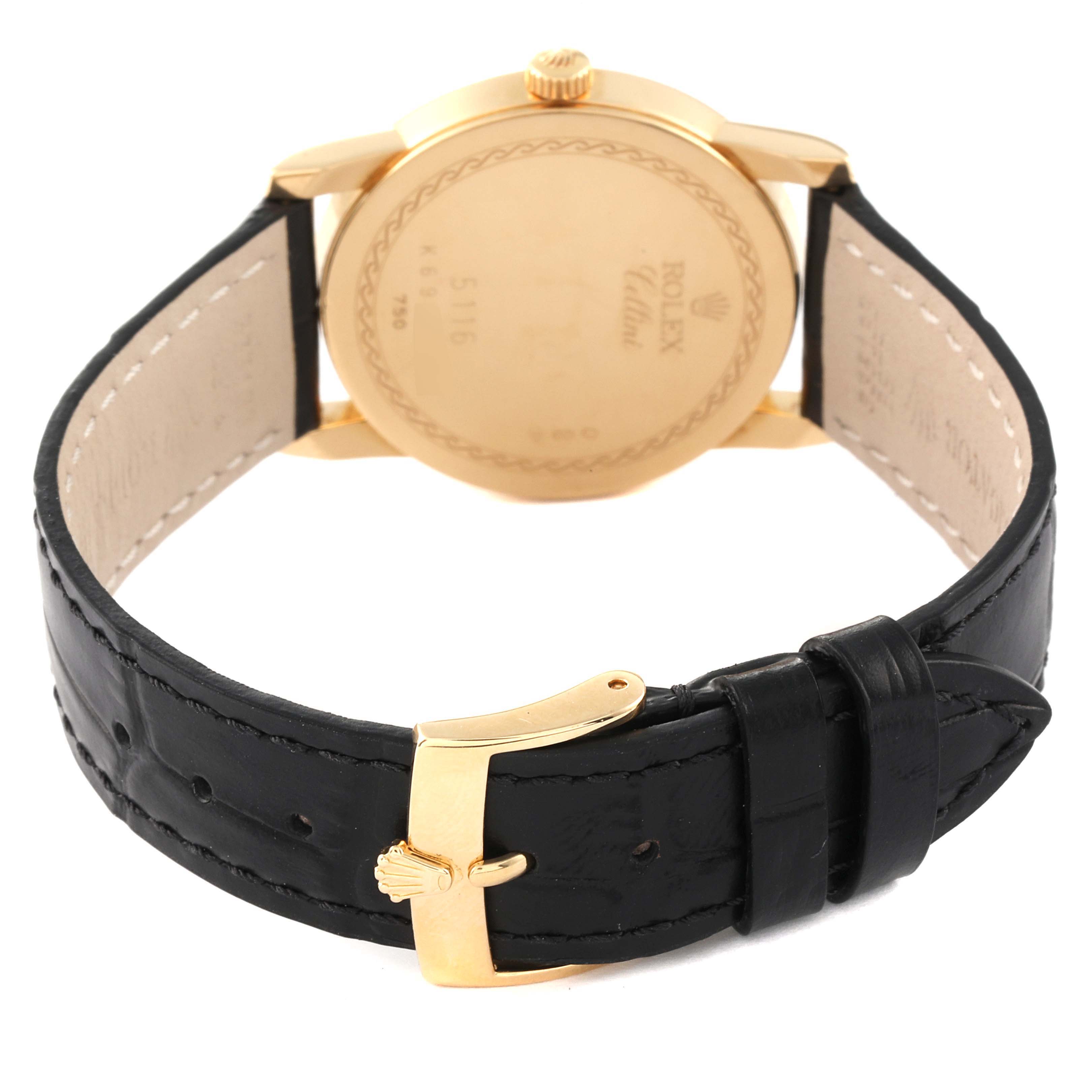 Image shows the back view of a Rolex Cellini 5116 Men's Yellow Gold Beige Dial 5116 Men's Yellow Gold Beige Dial watch including the case back and black leather strap with a gold buckle.