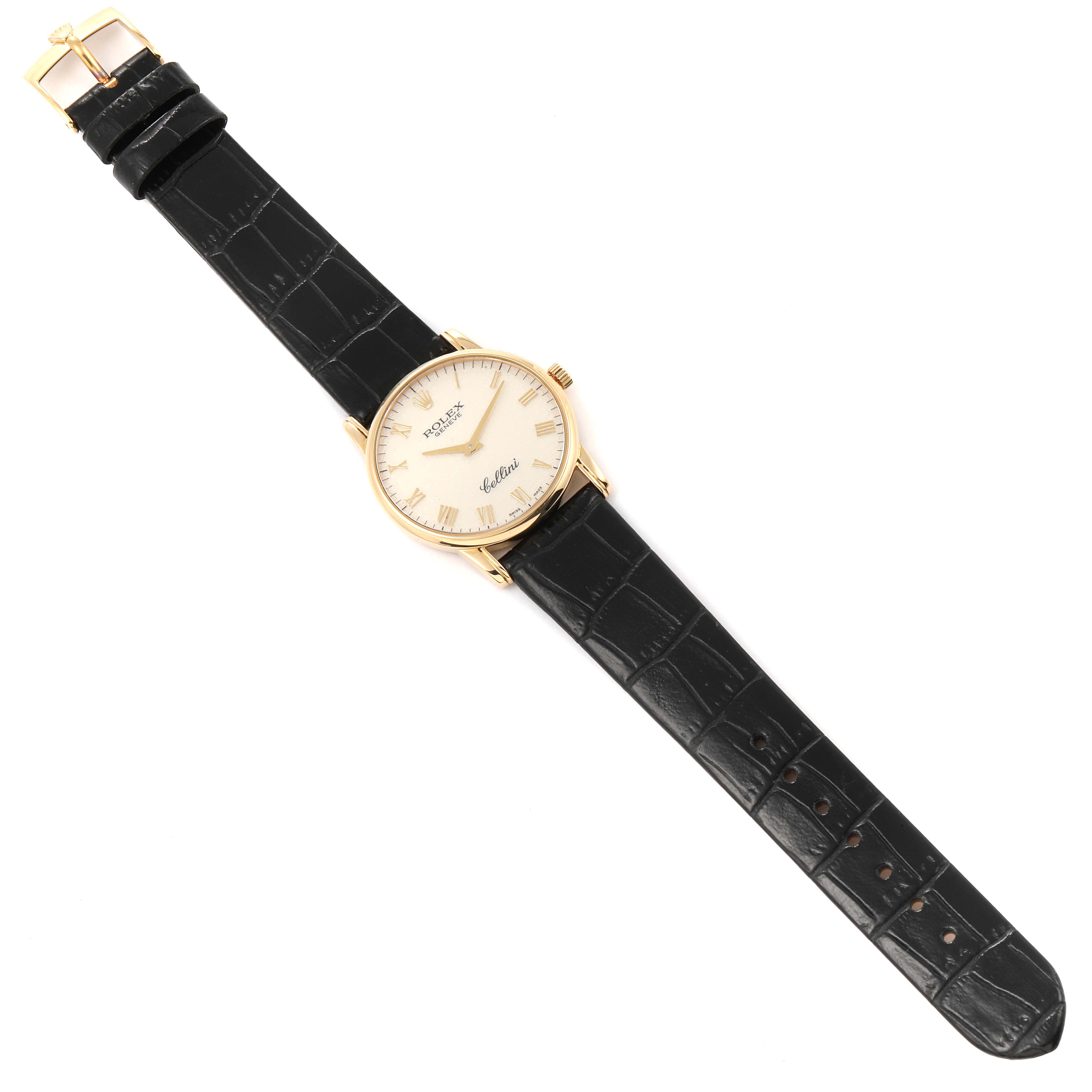 The image shows a top view of a Rolex Cellini 5116/8 Men's Yellow Gold Beige Dial 5116/8 Men's Yellow Gold Beige Dial watch with a black leather strap and gold casing.