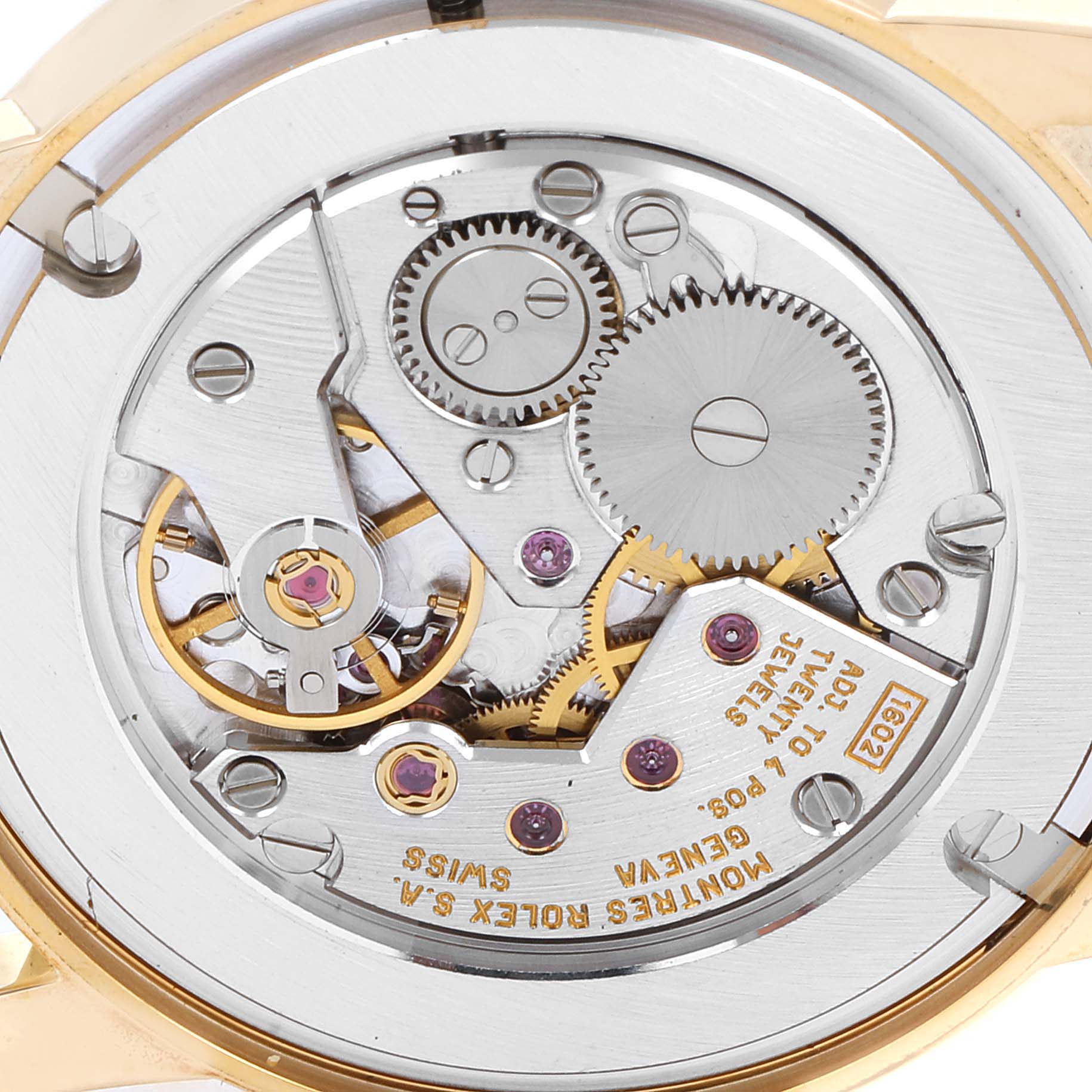 This image shows the inner mechanical movement of a Rolex Cellini 5116/8 Men's Yellow Gold Beige Dial 5116/8 Men's Yellow Gold Beige Dial watch, including gears and jewels, from a close-up angle.