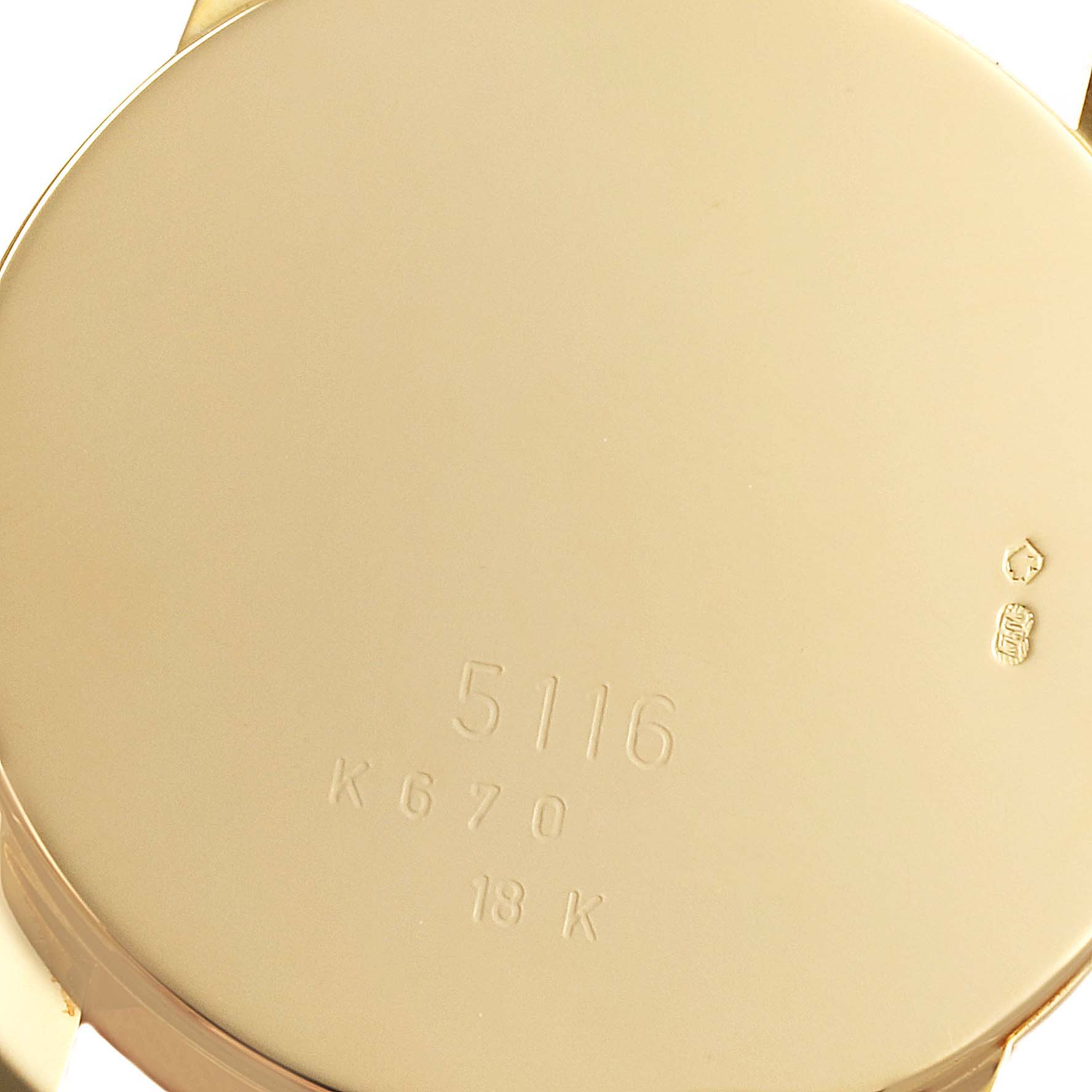This is the back casing of a Rolex Cellini 5116/8 Men's Yellow Gold Beige Dial 5116/8 Men's Yellow Gold Beige Dial model 5116, showing its 18K gold material and engraved markers.