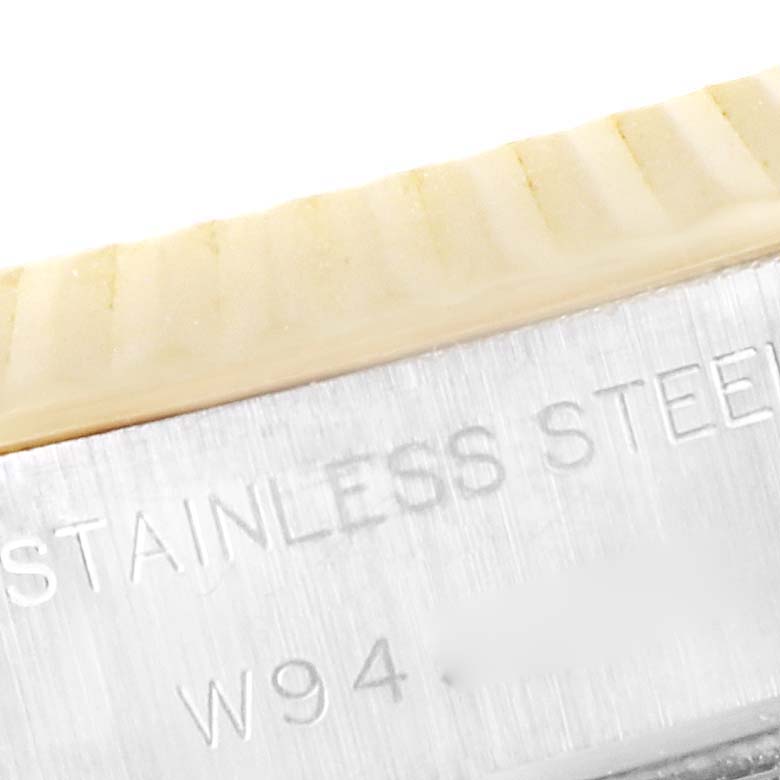 The close-up image shows part of the case and the fluted bezel of a Rolex Datejust 69173 Women's Steel and Gold (two tone) Blue Dial 69173 Women's Steel and Gold (two tone) Blue Dial, highlighting "STAINLESS STEEL".