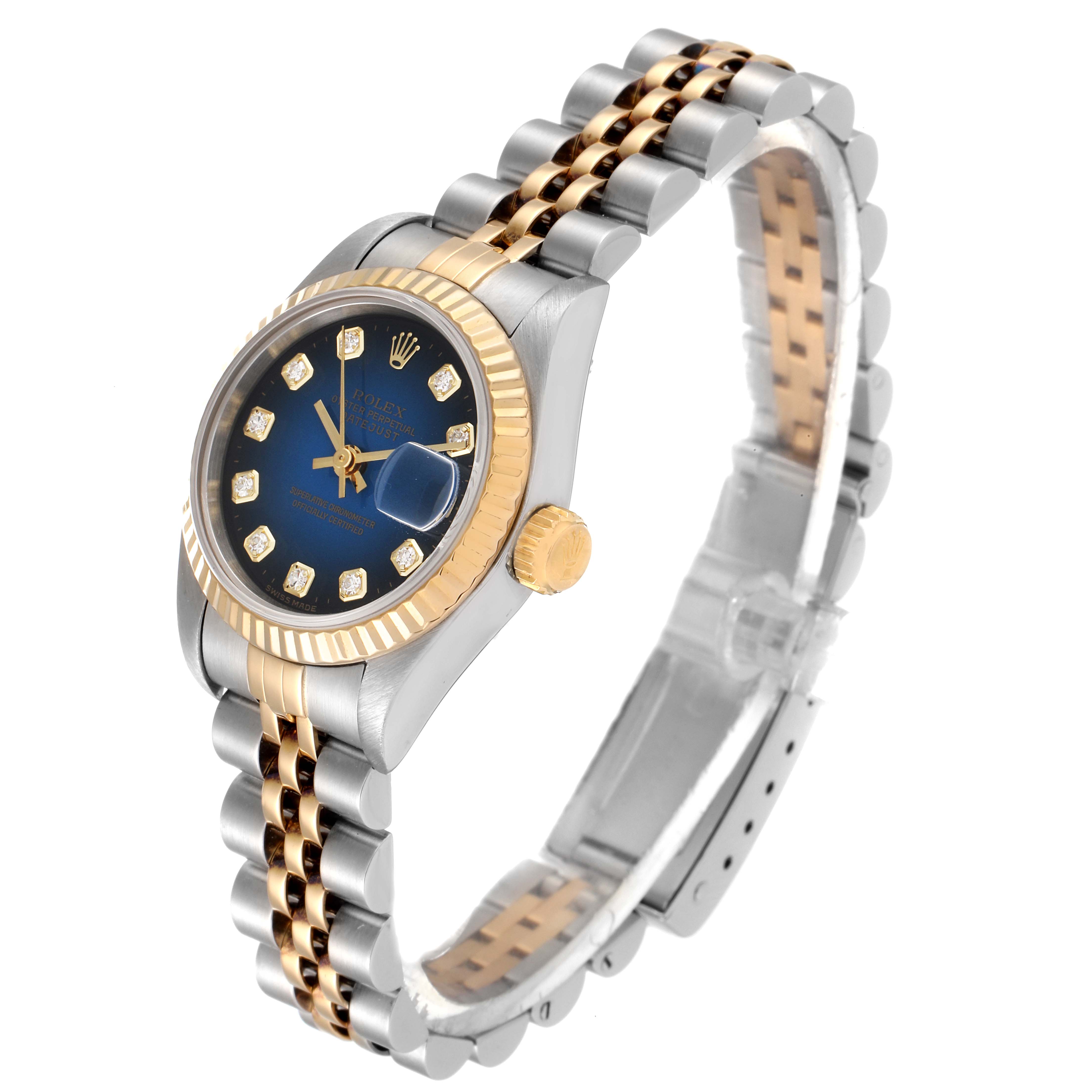 The Rolex Datejust 69173 Women's Steel and Gold (two tone) Blue Dial 69173 Women's Steel and Gold (two tone) Blue Dial watch is shown from an angled side view, displaying its face, bezel, crown, and bracelet.