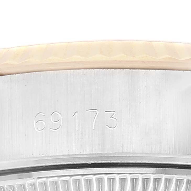 This close-up image of a Rolex Datejust 69173 Women's Steel and Gold (two tone) Champagne Dial 69173 Women's Steel and Gold (two tone) Champagne Dial model shows the watch case with the model number 69173 engraved.