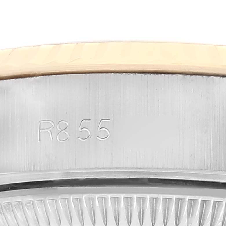 The image shows a close-up view of the serial number engraving on the case edge of a Rolex Datejust 69173 Women's Steel and Gold (two tone) Champagne Dial 69173 Women's Steel and Gold (two tone) Champagne Dial watch.