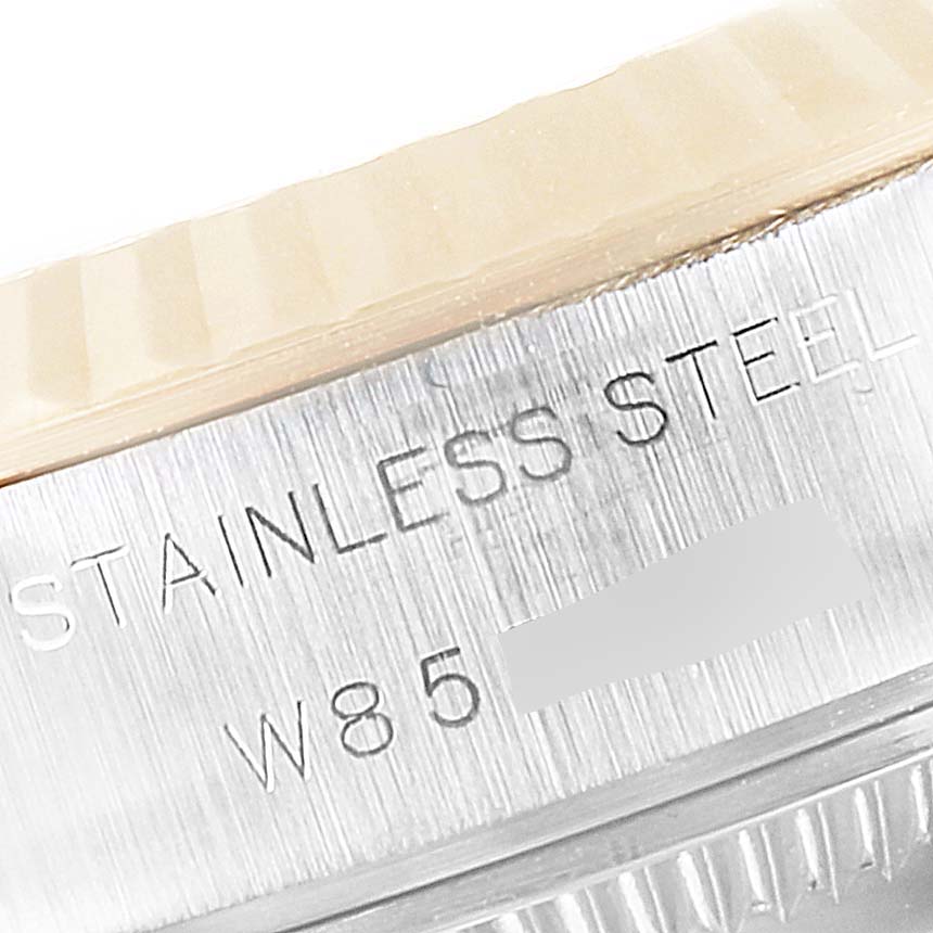 This image shows a close-up of the stainless steel case side with engravings on a Rolex Datejust 69173 Women's Steel and Gold (two tone) Champagne Dial 69173 Women's Steel and Gold (two tone) Champagne Dial watch.