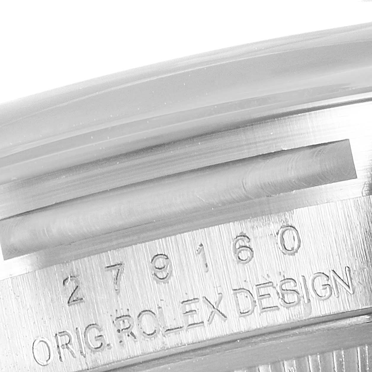 This close-up image of a Rolex Datejust 279160 Women
s Stainless Steel White Dial 279160 Women
s Stainless Steel White Dial watch shows the side of the case with the engraved model number and "ORIG. ROLEX DESIGN".