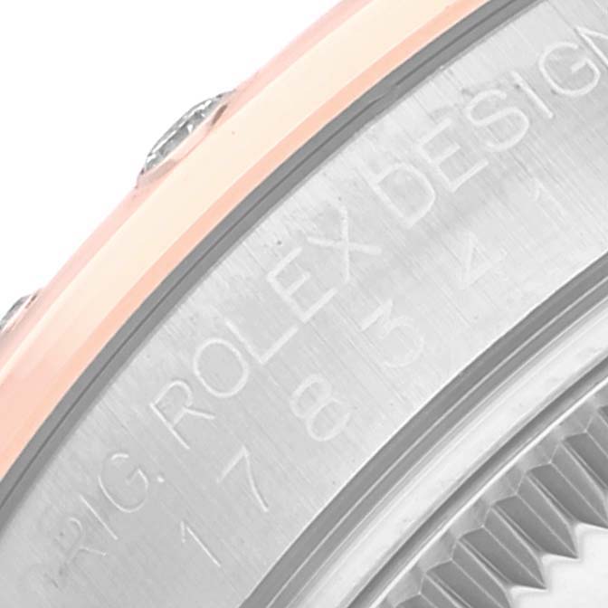 The image shows a close-up of the side engraving and bezel of a Rolex Mid-Size 178341 Women's Stainless Steel Brown Dial 178341 Women's Stainless Steel Brown Dial watch.