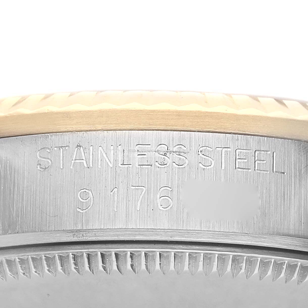 The image shows the side of a Rolex Datejust 68273 Women's Stainless Steel Champagne Dial, focusing on the stainless steel band with engraved text.