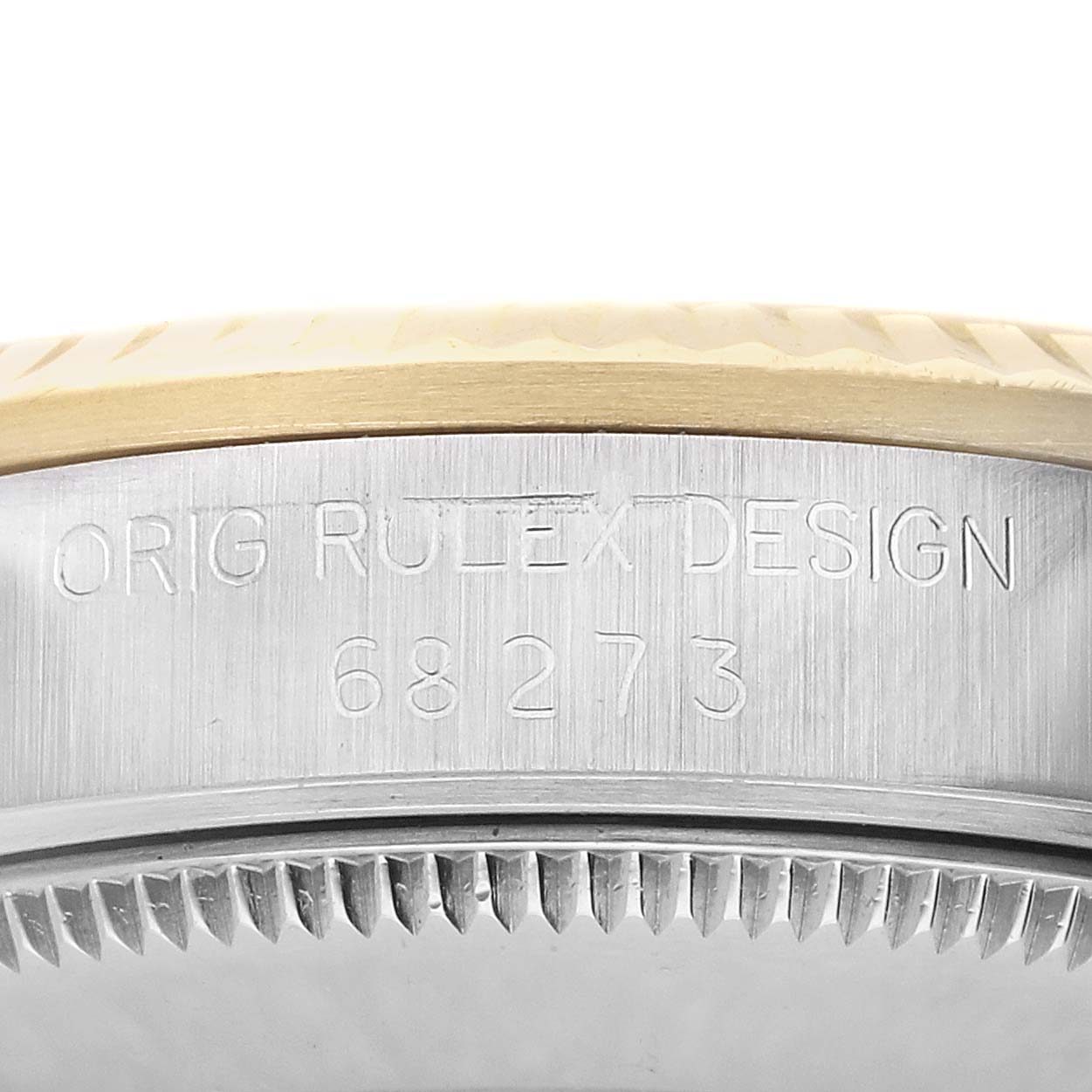 The image shows a partial side view of a Rolex Datejust 68273 Women's Stainless Steel Champagne Dial watch, focusing on the engraved case side with text and model number.