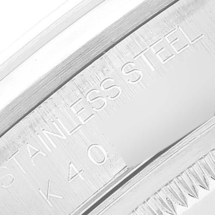 The image shows a close-up of the engraving on the stainless steel case of a Rolex Datejust 16200 Men's Stainless Steel Pink Dial 16200 Men's Stainless Steel Pink Dial watch.