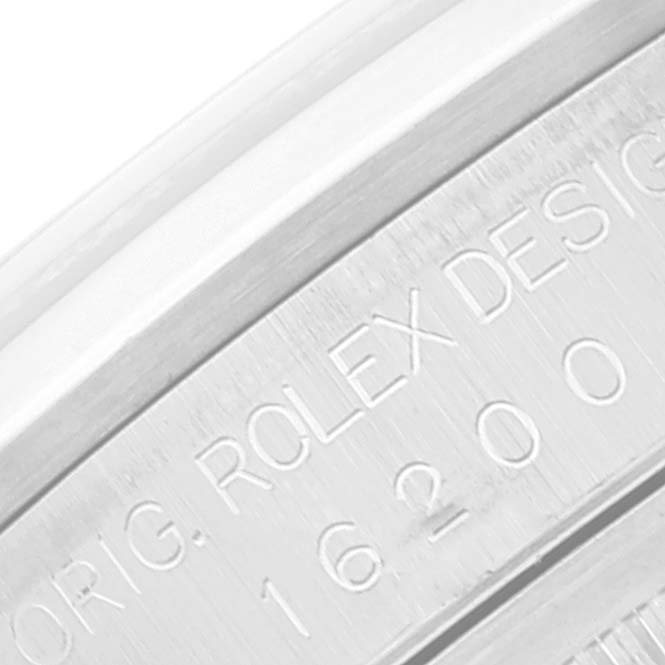 This image shows a close-up of the engraved side of a Rolex Datejust 16200 Men's Stainless Steel Pink Dial 16200 Men's Stainless Steel Pink Dial model, displaying the serial number and the "ORIG. ROLEX DESIGN" inscription.