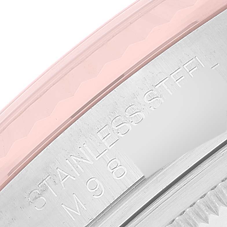 This image shows a close-up of the caseback and serial number engraving on the Rolex Datejust 116231 Men's Steel and Gold (two tone) Pink Dial 116231 Men's Steel and Gold (two tone) Pink Dial watch.