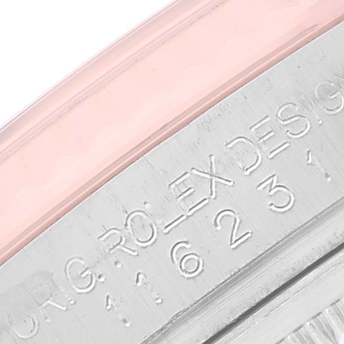 The image shows a close-up of the inner bezel and rehaut engraving of a Rolex Datejust 116231 Men's Steel and Gold (two tone) Pink Dial 116231 Men's Steel and Gold (two tone) Pink Dial watch.