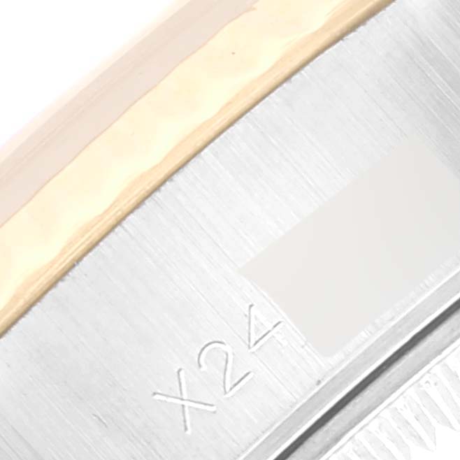 This close-up image focuses on the case side and part of the bezel of the Rolex Datejust 69173 Women's Steel and Gold (two tone) Black Dial 69173 Women's Steel and Gold (two tone) Black Dial model, showing the engraved marking "X24."