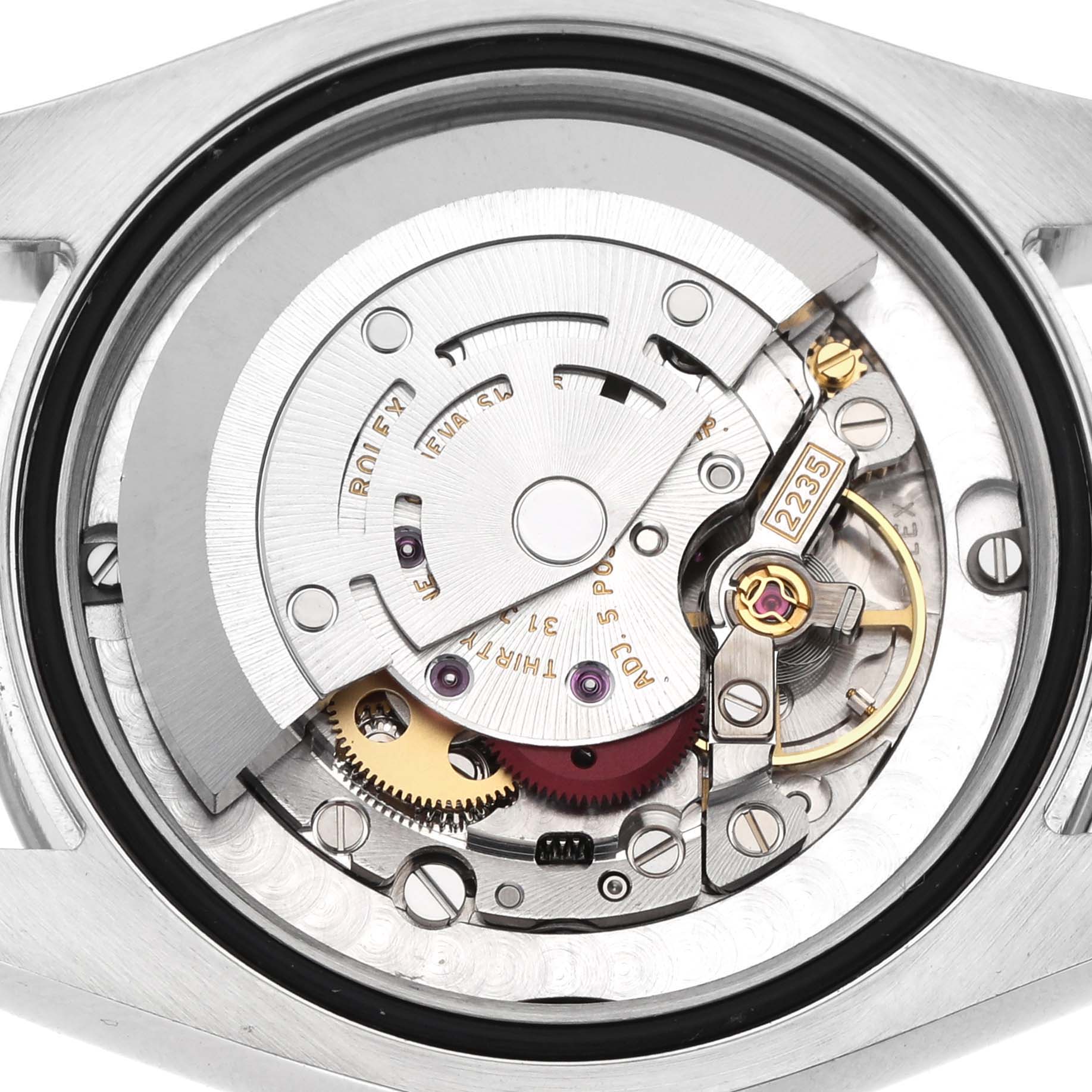 The image shows the movement mechanism of a Rolex Datejust 178240 Women's Stainless Steel Pink Dial watch from a top-down angle, highlighting gears and components.