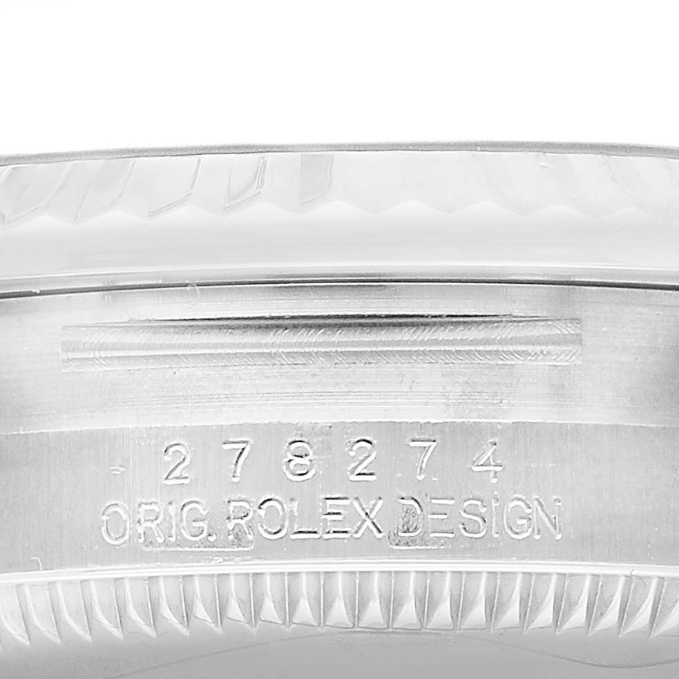 The image shows a close-up of the side of a Mid-Size Rolex watch case with the model number and "Orig Rolex Design" engraving.
