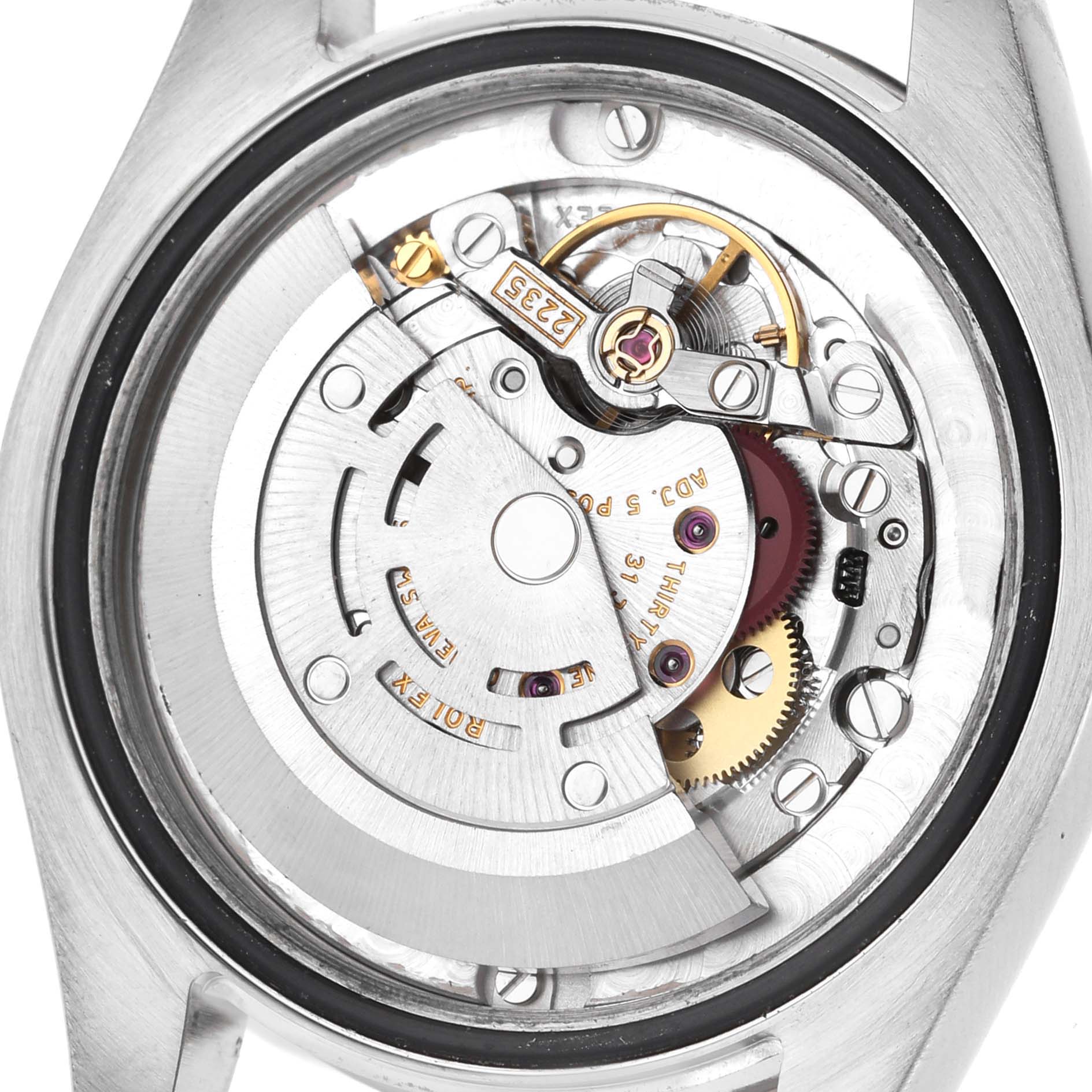 The image shows the mechanism of a Rolex Datejust 178274 Women's Stainless Steel Silver Dial watch viewed from the back, highlighting the rotor and inner components.