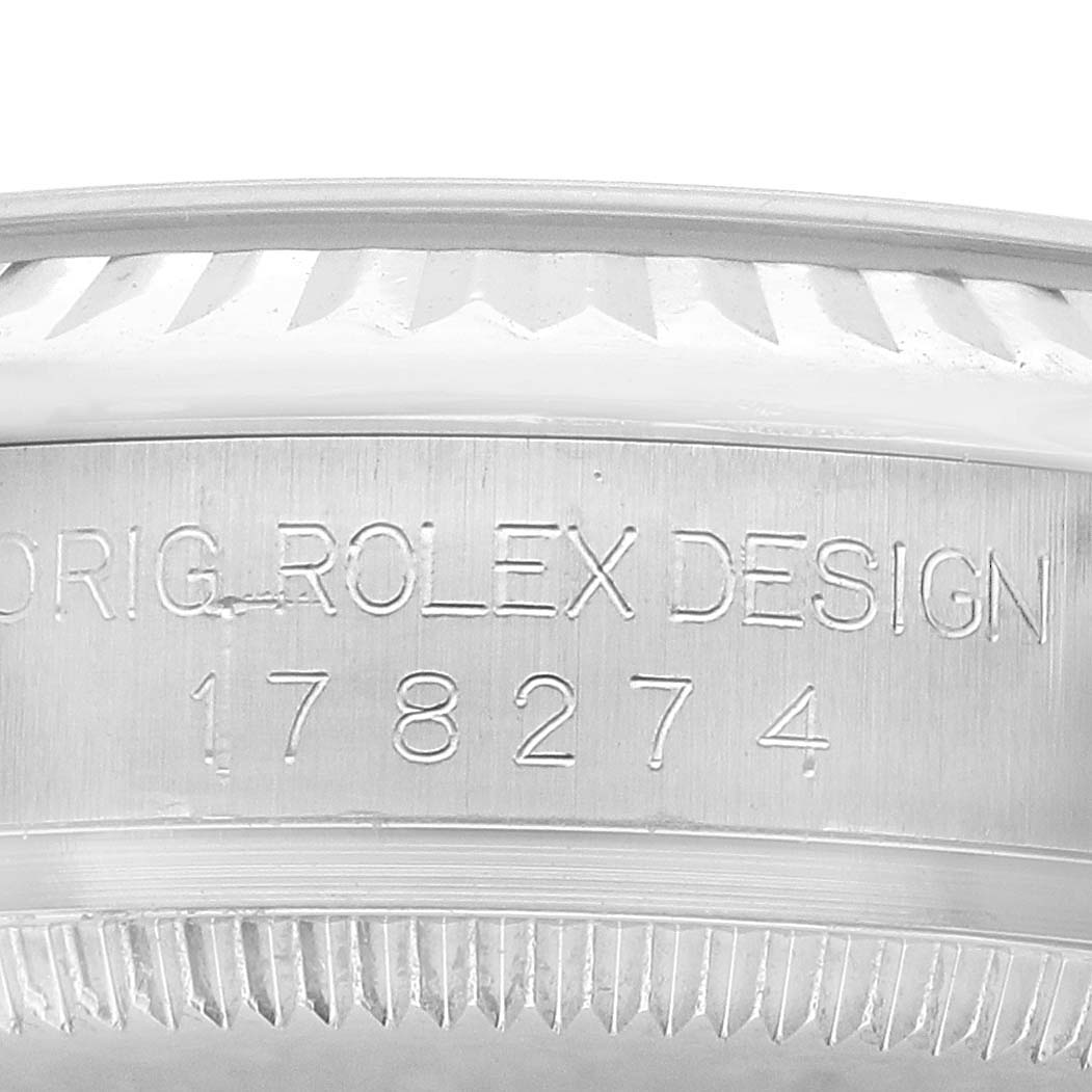 The image shows a close-up of the engraved side of the bezel and case of a Rolex Datejust 178274 Women's Stainless Steel Silver Dial watch.