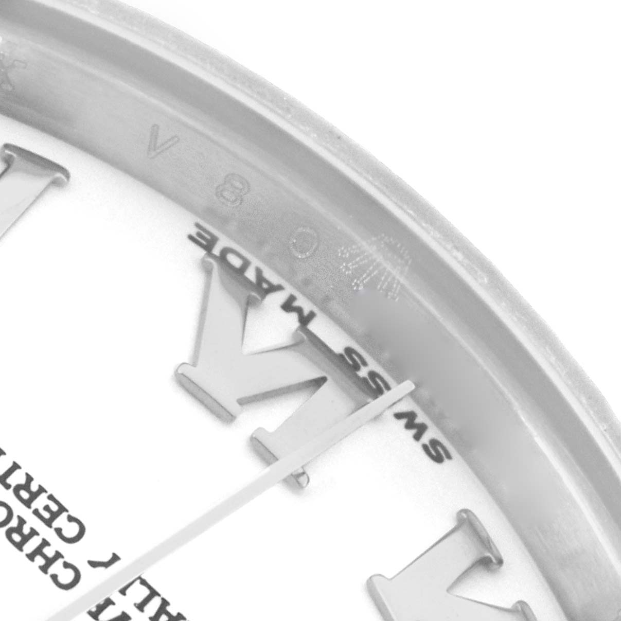 The image shows a close-up of the Rolex Datejust 178274 Women's Stainless Steel White Dial's dial edge, highlighting the Roman numeral and the "Swiss Made" marking.