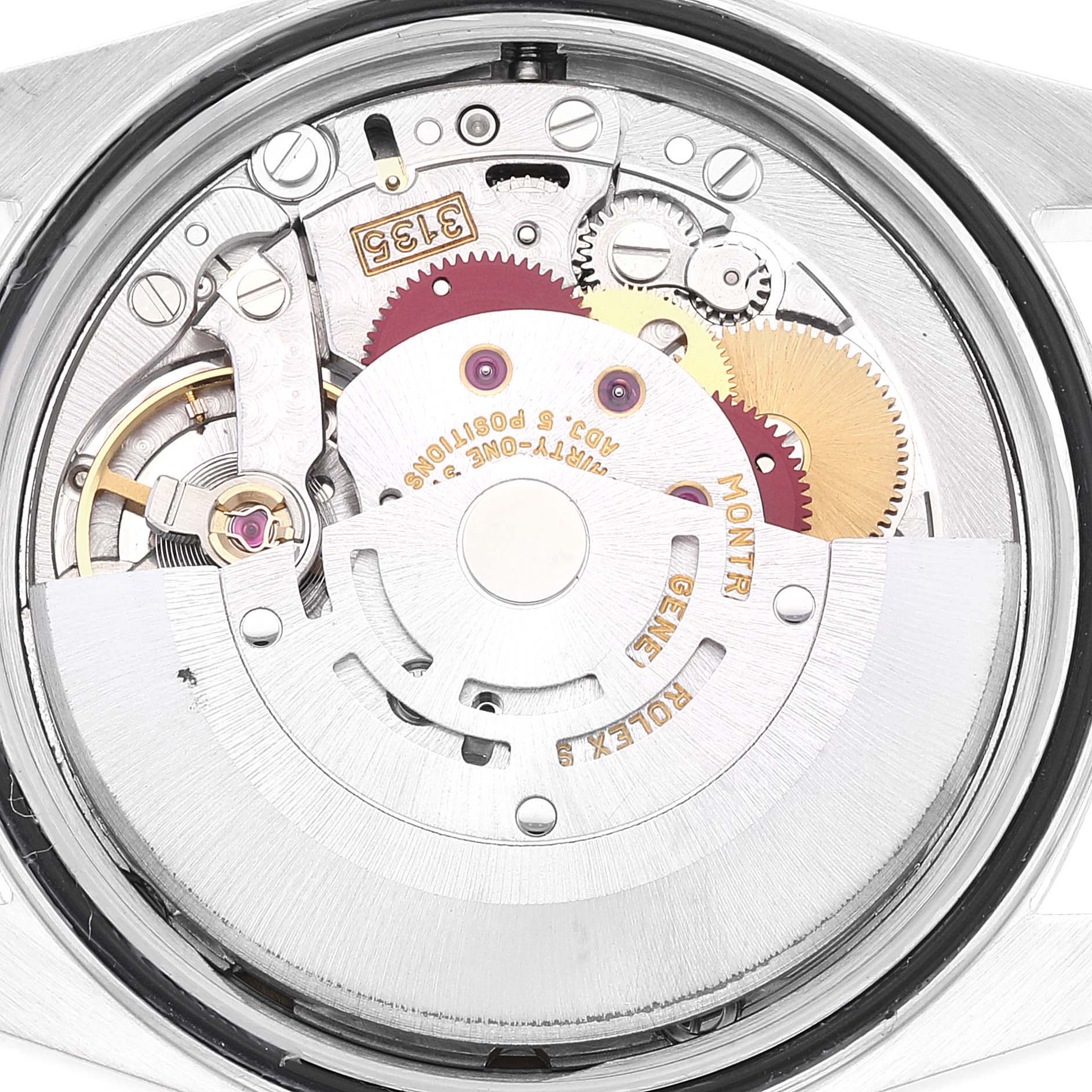 This image shows an angled view of the Rolex Datejust 16233 Men's Steel and Gold (two tone) White Dial 16233 Men's Steel and Gold (two tone) White Dial movement with visible gears and rotor.