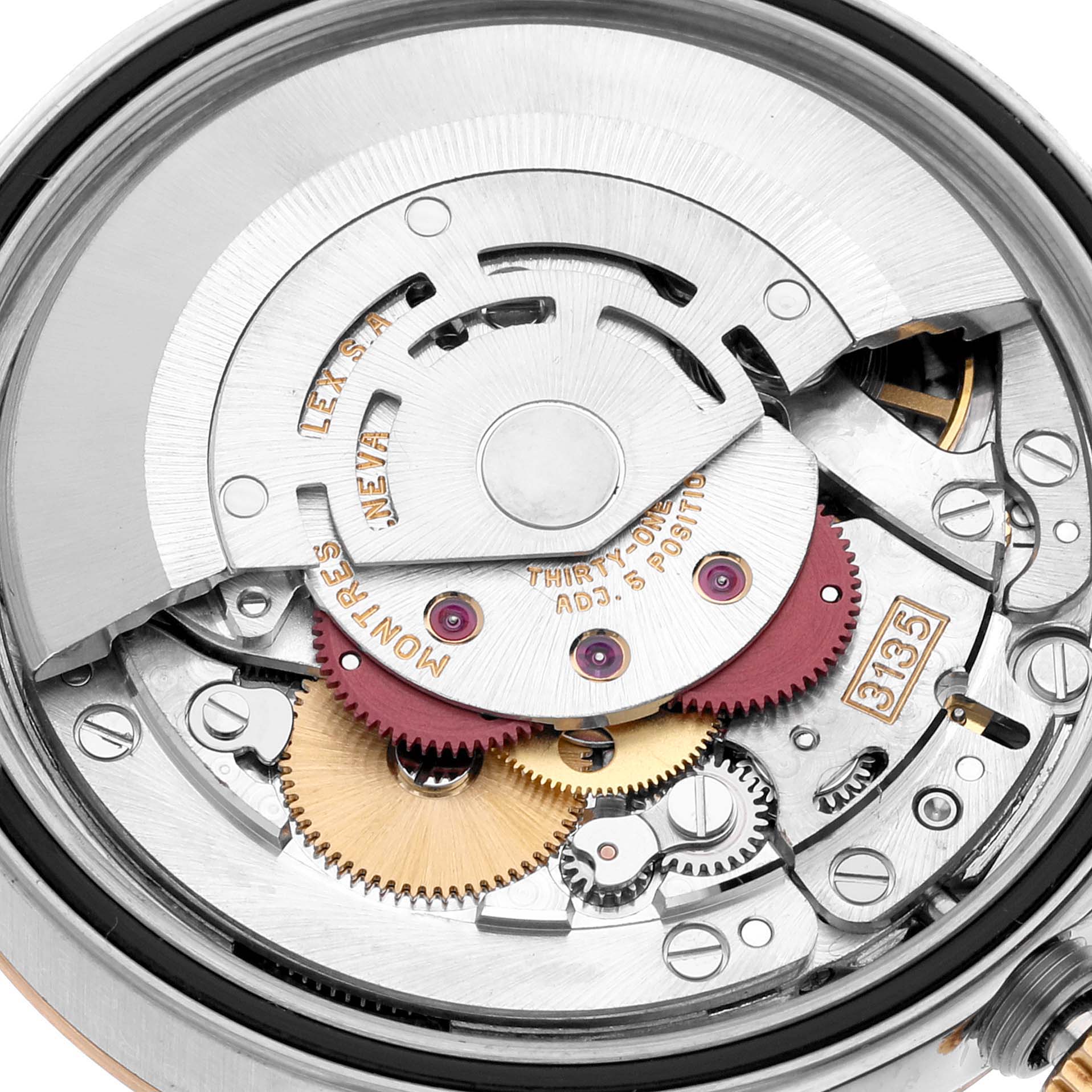 This image shows the intricate internal movement mechanism of a Rolex Datejust 16233 Men's Steel and Gold (two tone) Silver Dial 16233 Men's Steel and Gold (two tone) Silver Dial watch, highlighting gears and rotors.