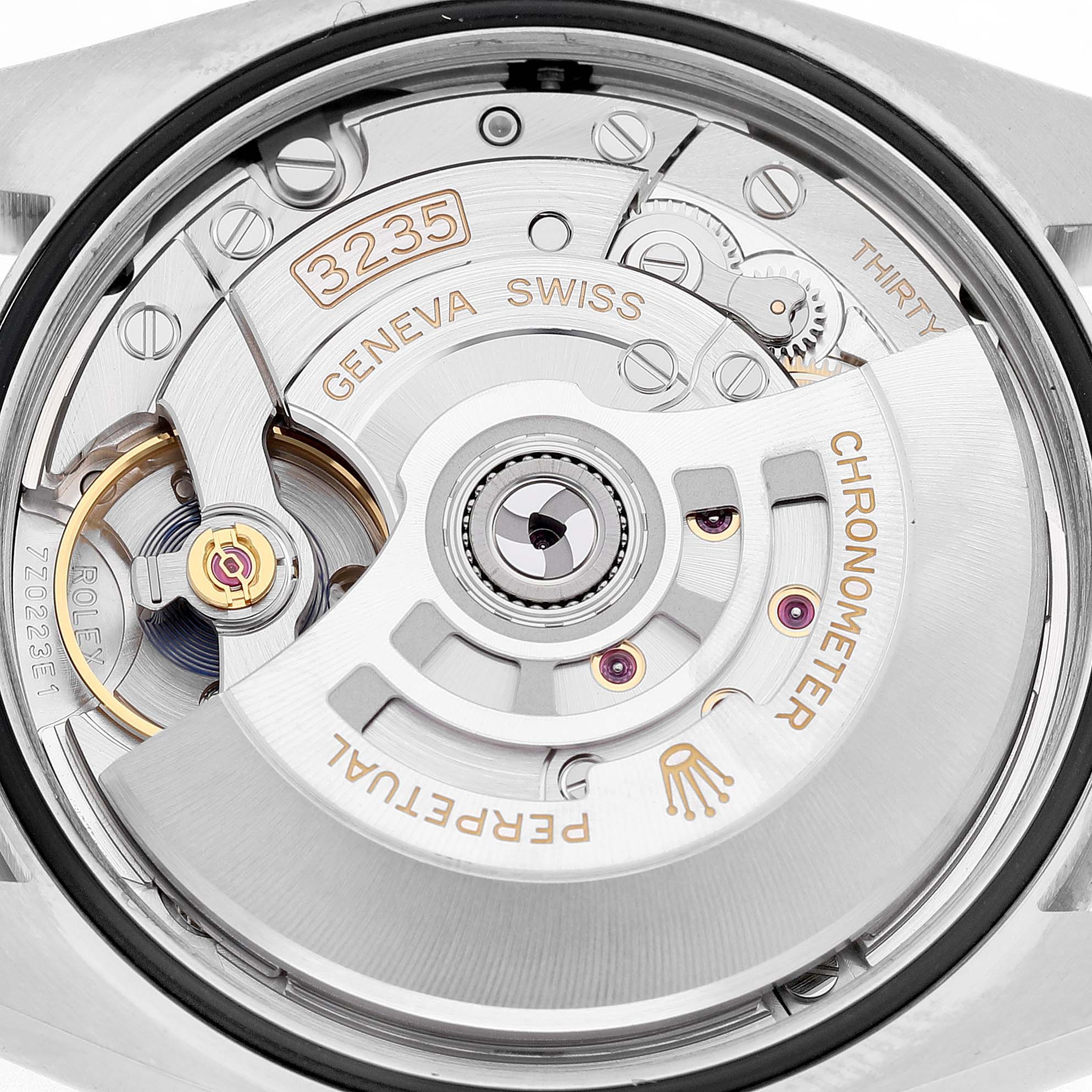 The image shows the movement and rotor of the Rolex Datejust 126234 Men's Stainless Steel Purple Dial watch from a back view angle.