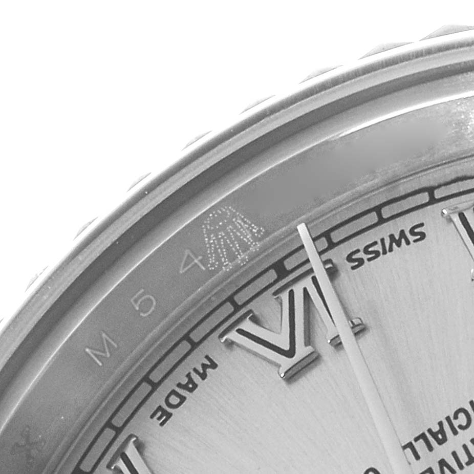 The image shows a close-up of the dial and partial bezel of a Rolex Datejust 179174 Women's Stainless Steel Silver Dial, highlighting the Roman numerals and "Swiss Made" text.