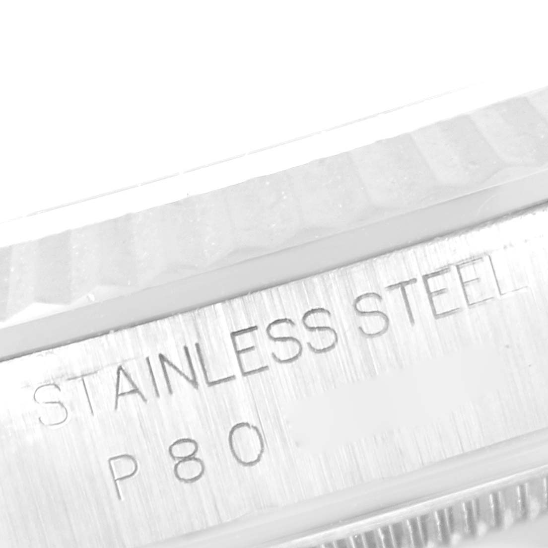 This image shows a close-up of the stainless steel inscription on the casing of a Rolex Datejust 16234 Men's Stainless Steel White Dial 16234 Men's Stainless Steel White Dial watch.