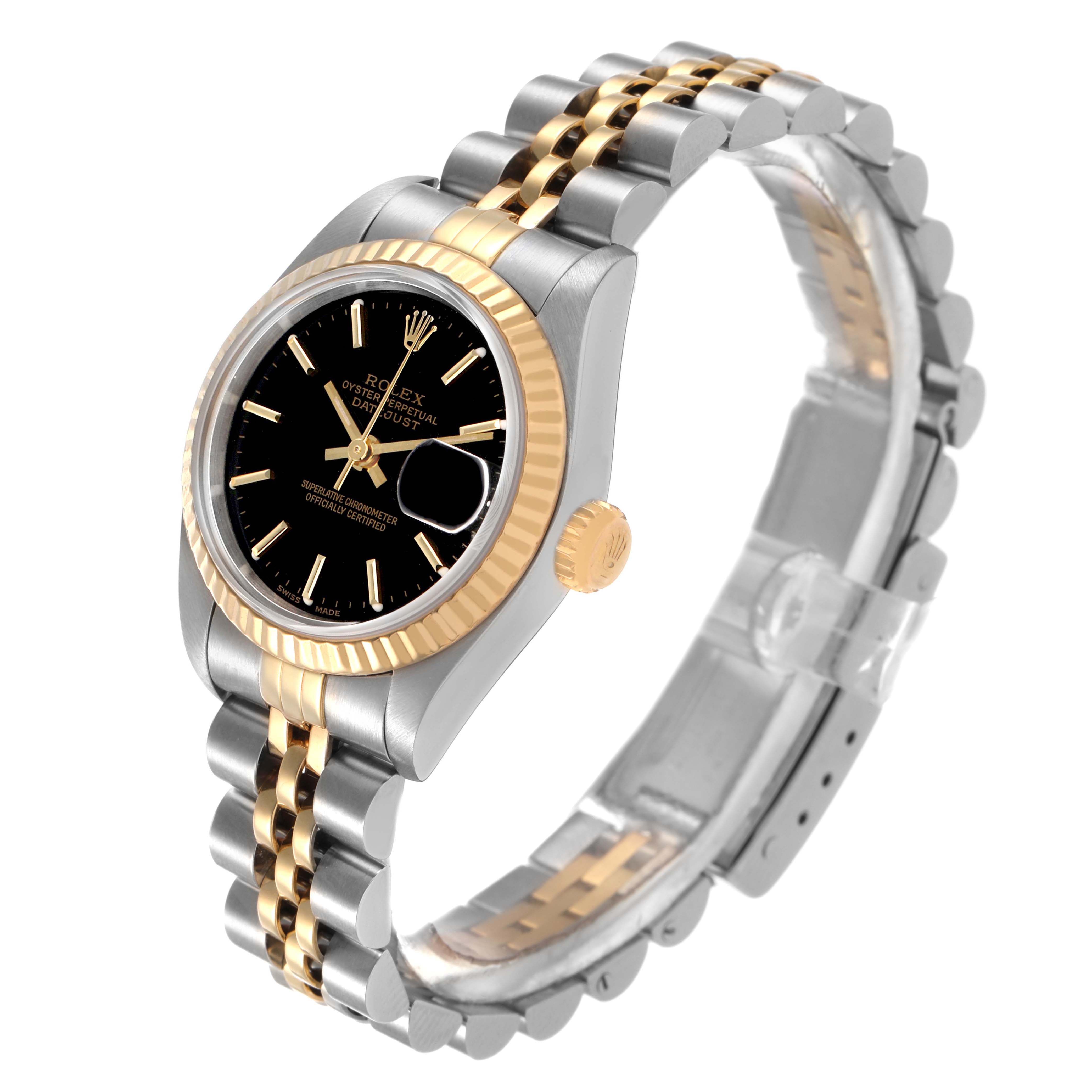 The Rolex Datejust 79173 Women's Steel and Gold (two tone) Black Dial watch is shown at a slight angle, displaying the black dial, fluted bezel, crown, and two-tone Jubilee bracelet.