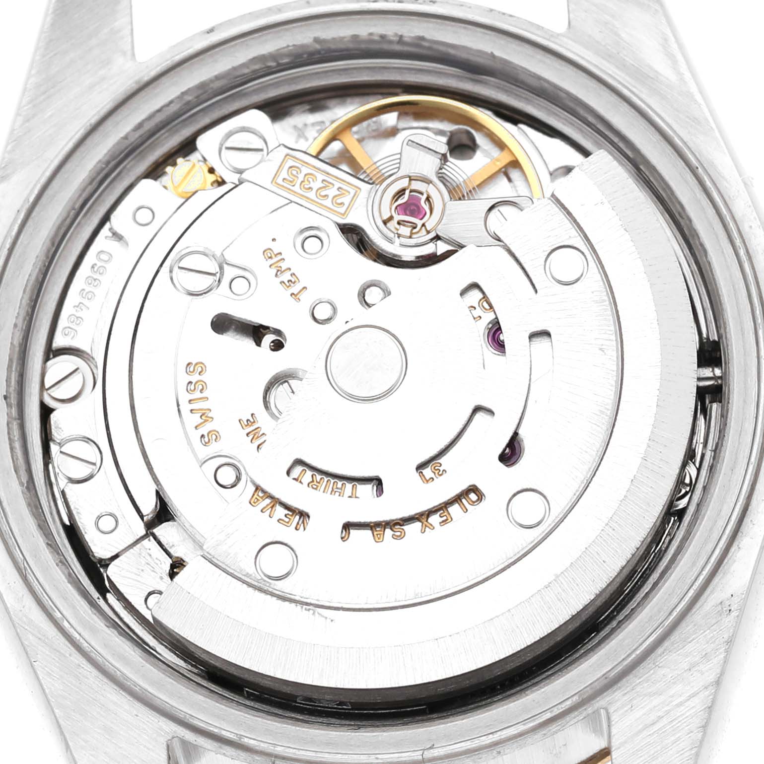 The image shows the movement of a Rolex Datejust 79173 Women's Steel and Gold (two tone) Black Dial watch from the back, highlighting the rotor and balance wheel.
