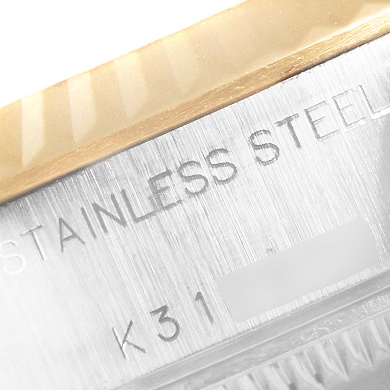 The image shows a close-up view of the stainless steel casing and part of the bezel of a Rolex Datejust 79173 Women's Stainless Steel Blue Dial 79173 Women's Stainless Steel Blue Dial watch.