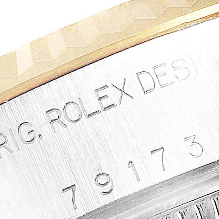 The image shows a close-up of the case side of a Rolex Datejust 79173 Women's Stainless Steel Blue Dial 79173 Women's Stainless Steel Blue Dial, highlighting the engraved model number and bezel edge.