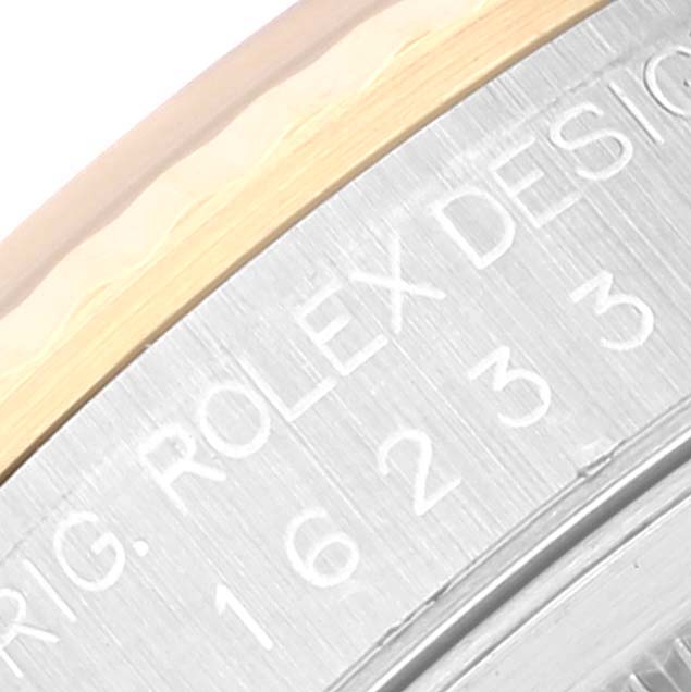 The image shows a close-up view of the case back and edge of the bezel of a Rolex Datejust 16233 Men's Stainless Steel Champagne Dial 16233 Men's Stainless Steel Champagne Dial watch.