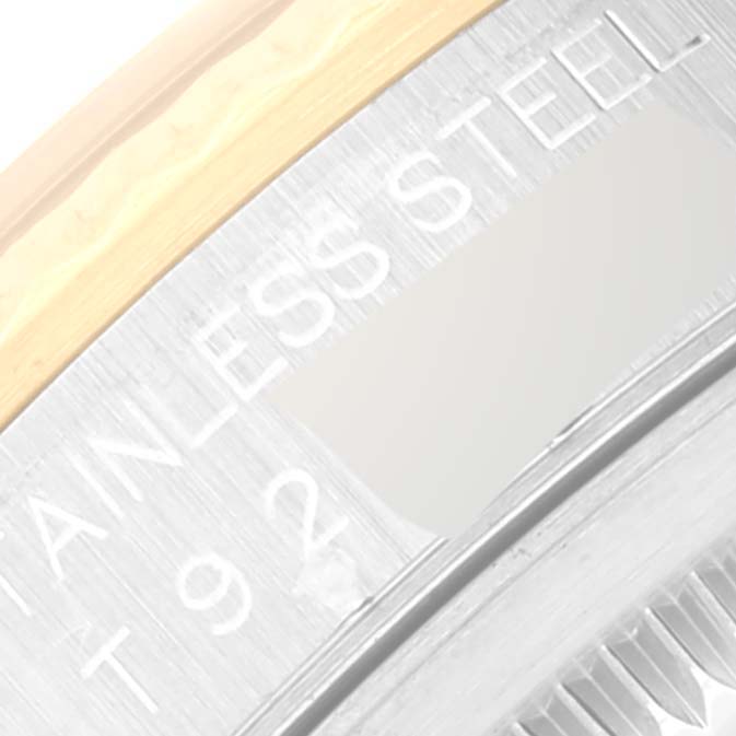 This image shows a close-up view of the case back of a Rolex Datejust 16233 Men's Stainless Steel Champagne Dial 16233 Men's Stainless Steel Champagne Dial, highlighting the stainless steel and part of the case edge.