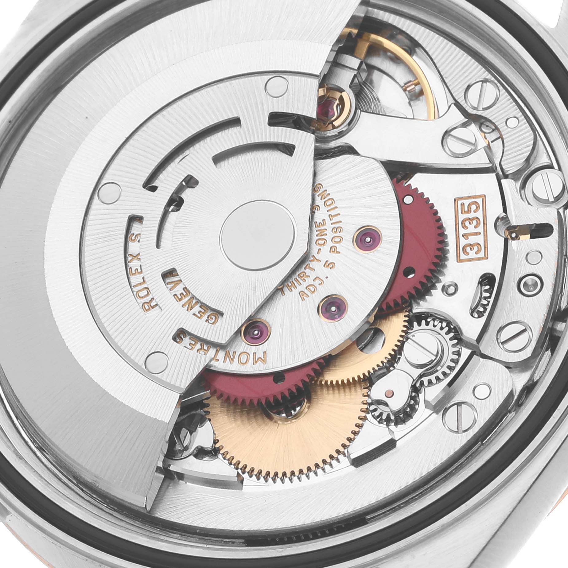 This is a close-up view of the internal mechanism of a Rolex Datejust 16233 Men's Stainless Steel Champagne Dial 16233 Men's Stainless Steel Champagne Dial watch, showcasing its intricate gears and rotor.