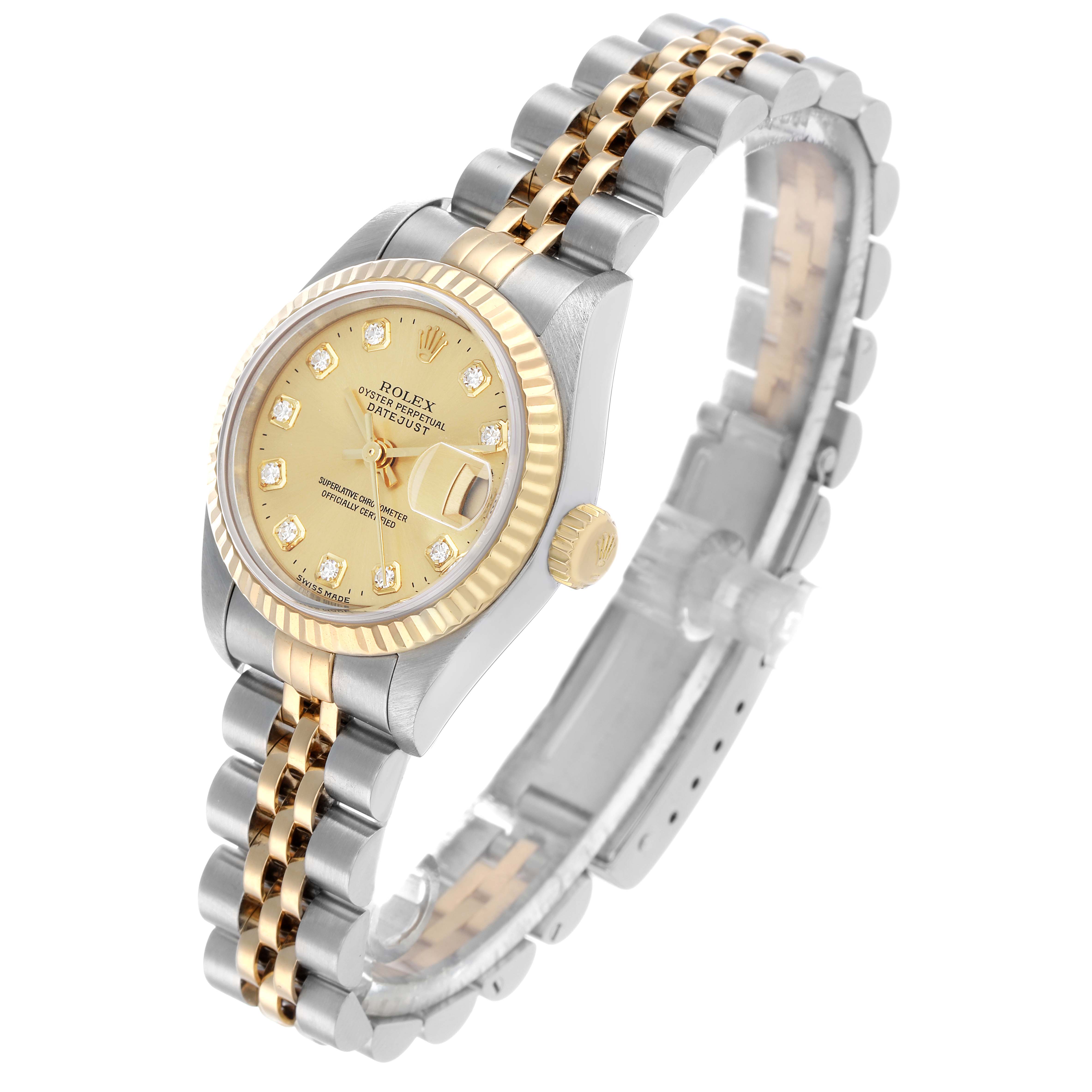 The image shows a Rolex Datejust 79173 Women's Steel and Gold (two tone) Champagne Dial watch at an angle displaying the dial, bezel, crown, and part of the bracelet.