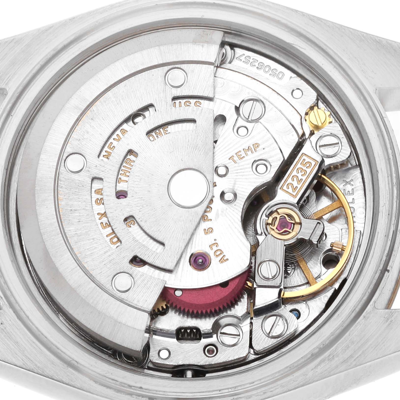 The image shows the internal movement of a Rolex Datejust 79173 Women's Steel and Gold (two tone) Champagne Dial watch, highlighting gears and intricate mechanical components.