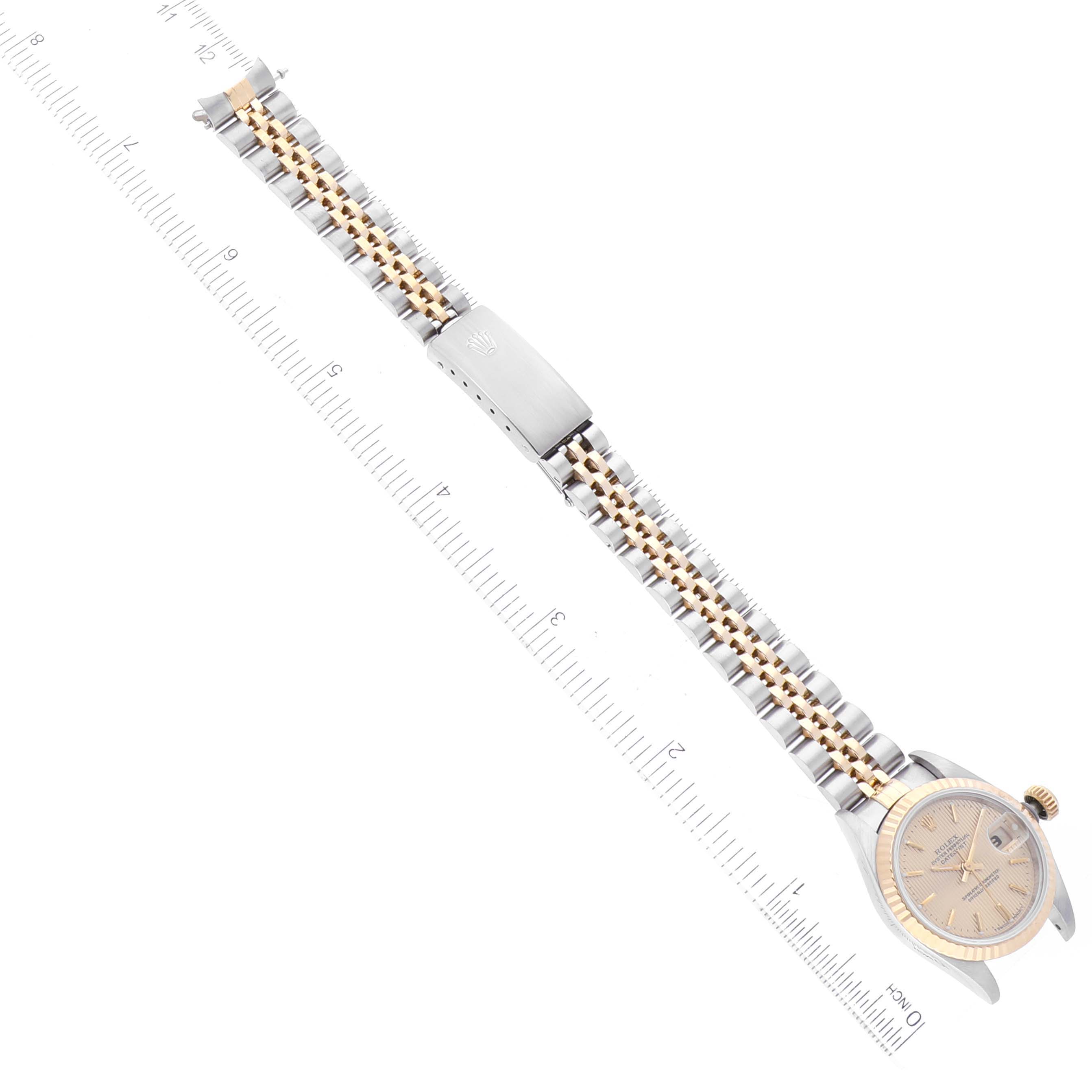 The Rolex Datejust 69173 Women's Steel and Gold (two tone) Champagne Dial 69173 Women's Steel and Gold (two tone) Champagne Dial watch is displayed laid flat, showcasing its bracelet, clasp, and watch face.