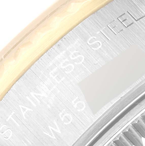 A close-up view of the side of a Rolex Datejust 69173 Women's Steel and Gold (two tone) Champagne Dial 69173 Women's Steel and Gold (two tone) Champagne Dial watch, showing the "STAINLESS STEEL" engraving.
