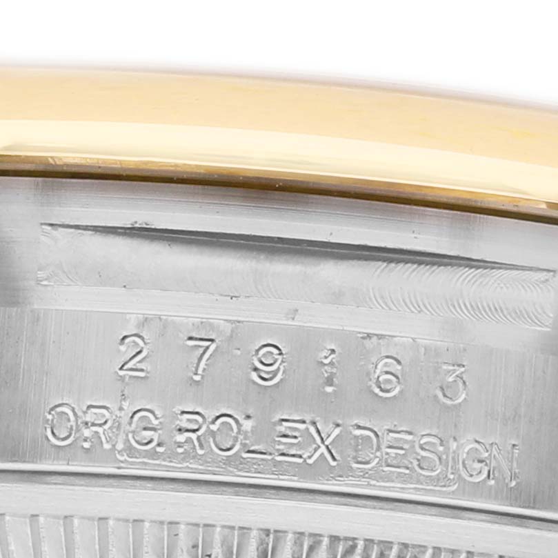 The image shows a close-up of the side of a Rolex Datejust 279163 Women's Steel and Gold (two tone) Champagne Dial watch, focusing on the serial number and "ORIG ROLEX DESIGN" engraving.