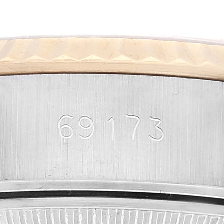 This close-up photo of the Rolex Datejust 69173 Women's Steel and Gold (two tone) Champagne Dial 69173 Women's Steel and Gold (two tone) Champagne Dial model shows the side of the watch case with the serial number 69173.