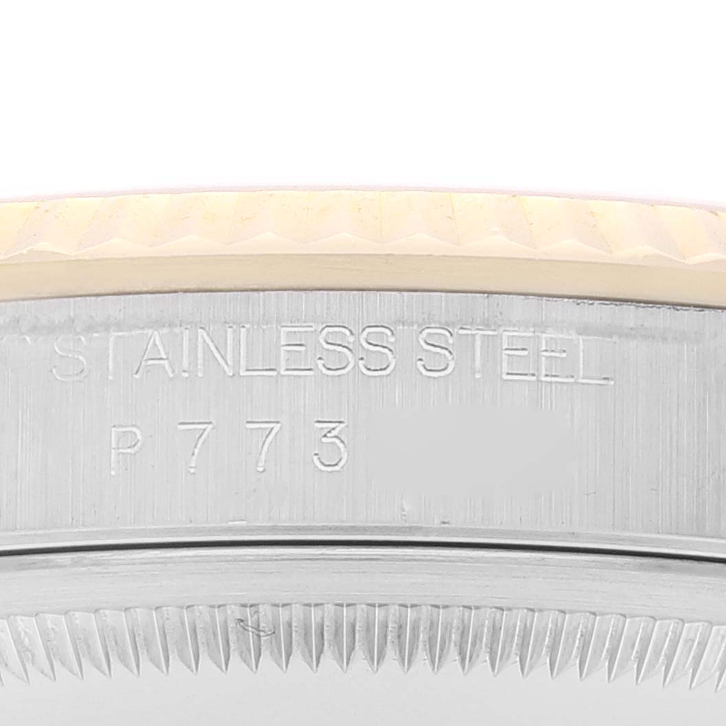 This close-up image shows the stainless steel case and serial number of a Rolex Datejust 16233 Men's Steel and Gold (two tone) Champagne Dial 16233 Men's Steel and Gold (two tone) Champagne Dial model.