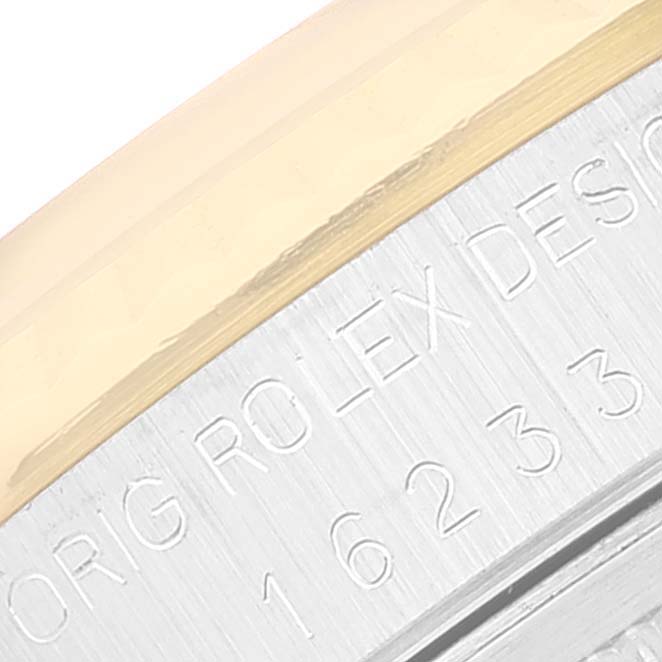 This close-up image shows the side engraving of a Rolex Datejust 16233 Men's Steel and Gold (two tone) Champagne Dial 16233 Men's Steel and Gold (two tone) Champagne Dial model watch.