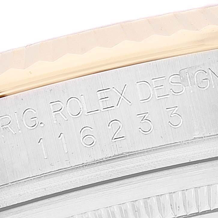The image shows a close-up of the engraved case side of a Rolex Datejust 116233 Men's Steel and Gold (two tone) Mother of Pearl Dial 116233 Men's Steel and Gold (two tone) Mother of Pearl Dial watch.