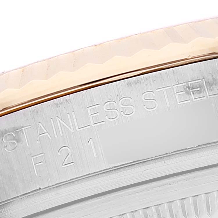 The image shows a close-up of the bezel and inner case with "STAINLESS STEEL" engraving on a Rolex Datejust 116233 Men's Steel and Gold (two tone) Mother of Pearl Dial 116233 Men's Steel and Gold (two tone) Mother of Pearl Dial watch.